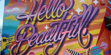 'Hello Beautiful' Wynwood mural, a striking visual delight adding charm, cruise liners