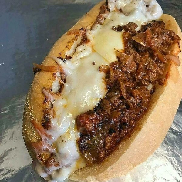 Shaved Ribeye, Onions, Mushrooms, with Red Sauce with  Provolone Cheese on a fresh Roll.