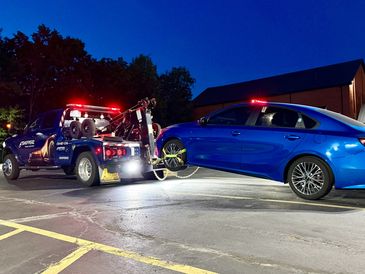 Shipperz Towing & Recovery Wrecker at night
