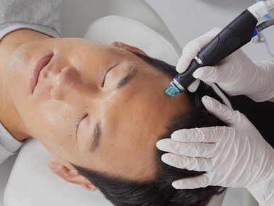 Hydrafacial wand is performed on a man. 