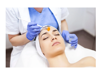 Chemical peel is being applied to a woman. 