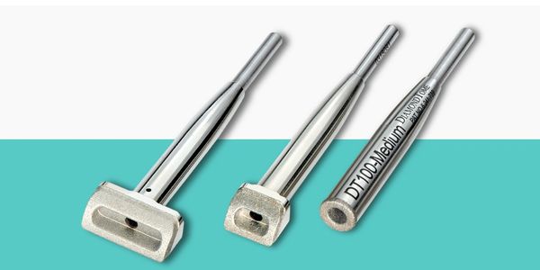 Three diamond microdermabrasion tips with stainless steel handles displayed against a teal and white.