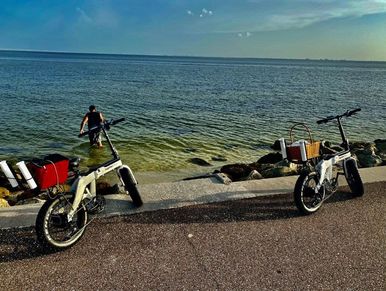 2 electric bikes on the Tampa Bay on the 9 mile waterfront bike trail. www.whatsuppaddlesports.com