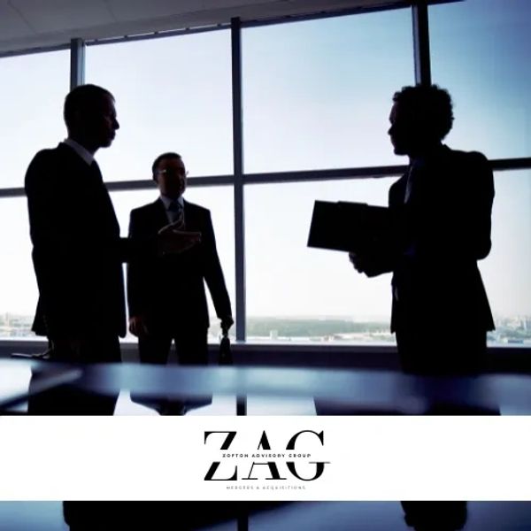 Silhouettes of three business professionals discussing in a modern office with large windows.