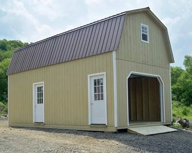 Two story Gambrel Garage on a driveway