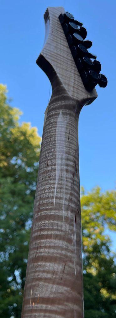 XS highly figured neck with extended offset head.