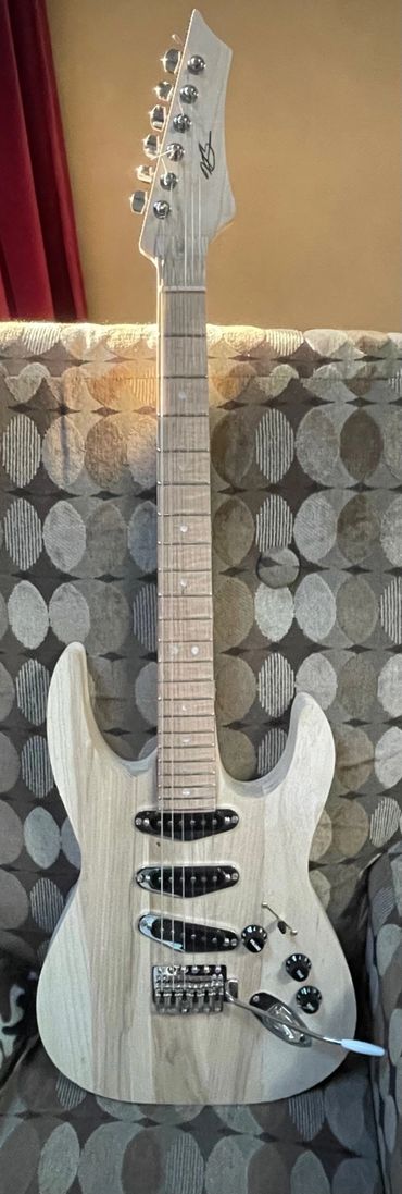 XS "Misfit" 6 string guitar with solid Swamp Ash body.