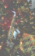Free Christmas Saxophone Wallpaper / Screensavers - Light Picture - For Cell Phones - White Yamaha Alto Sax under the tree.