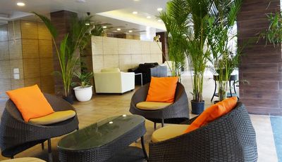 Green and beautiful Baner hotel reception seating area.