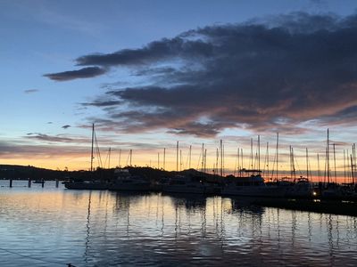 boats moored in a marina at sunset on San Francisco Bay