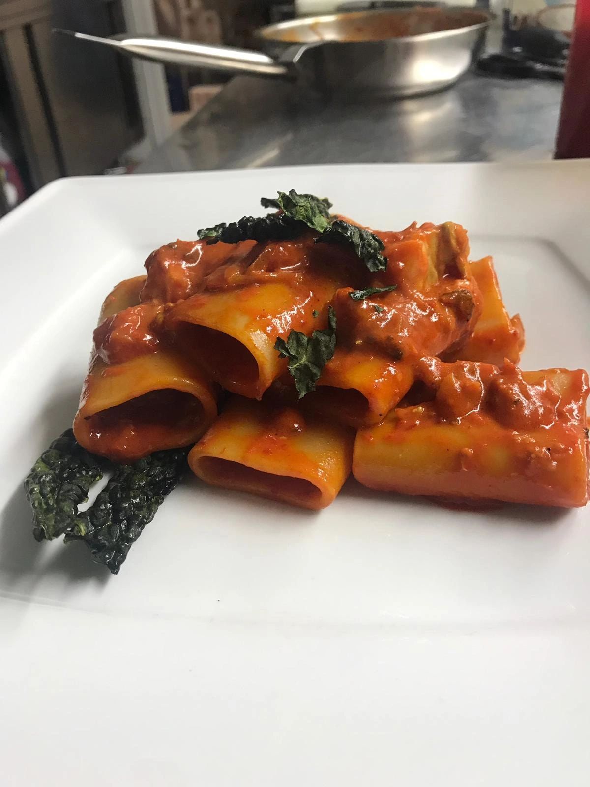 pasta pacchero with senise pepper cream, cod fish and a dried black kale made by giulia del bene