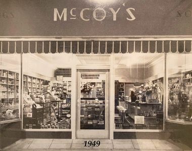 A sepia photo of the McCoy Tygart storefront from 1949.