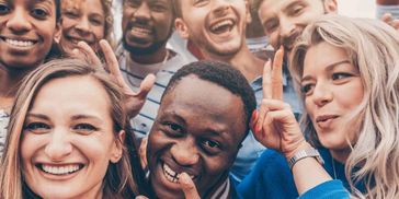 A diverse group of friends smiling and having fun together.