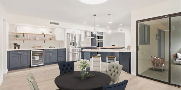 Complete remodel of a  Modern kitchen with navy cabinets, updated light fixtures ,flooring,paint custom floating shelves.