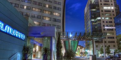 Exterior view of a modern urban building at night.