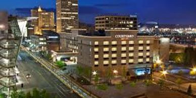 Cityscape with a Courtyard hotel at night.