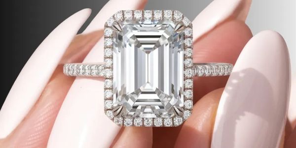 Custom emerald-cut diamond ring in platinum—timeless, unisex, bespoke, reflecting unique elegance.