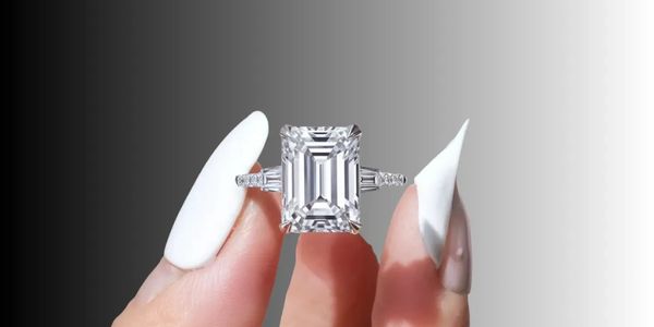 Luxury emerald cut three-stone engagement ring—timeless design, radiant brilliance, bespoke elegance