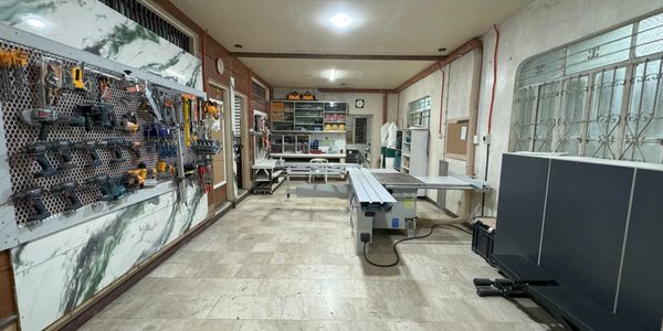 Modern workshop equipped with advanced tools, machinery, and organized storage by Kirin Apex