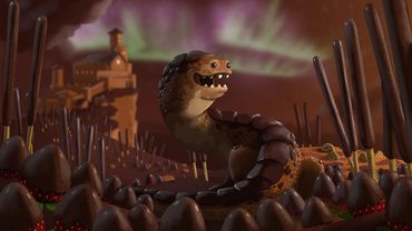 A beast standing in a fantasy land where everything is made of chocolate and candy.