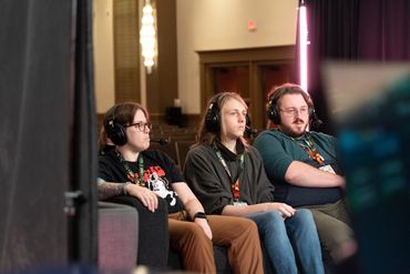 couch people commenating awesome games done quick microphone sitting hanging out sitcom