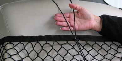 Elastic cord helps retain fragile items.