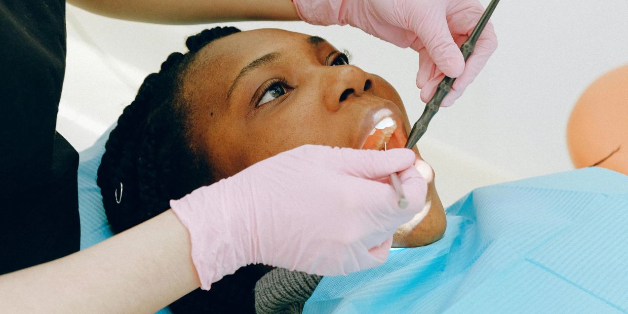 Patient receiving dental check-up.