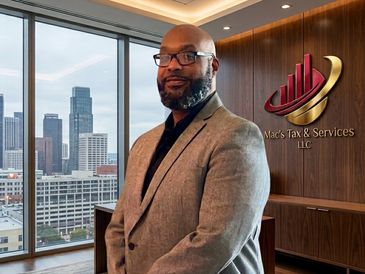 Professional man in office with city view.