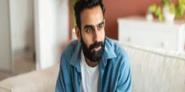 A man attentively listens during a counseling session.