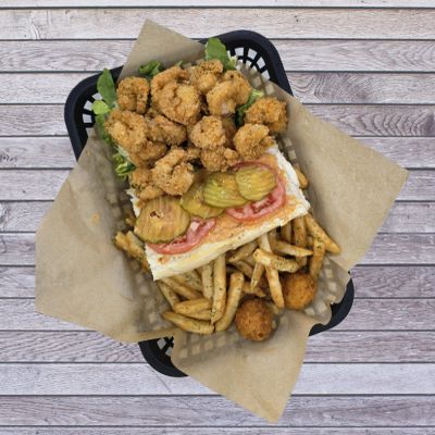 Fried shrimp po'boy with fries and hush puppies.