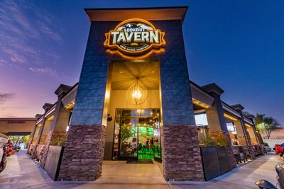 Exterior view of Lookout Tavern at dusk with illuminated sign.