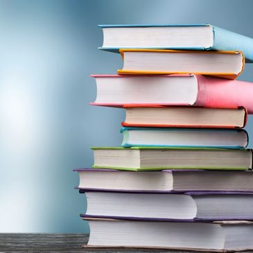 A bunch of books with blue background