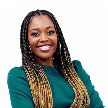 Confident woman with braided hair smiling in a green top.