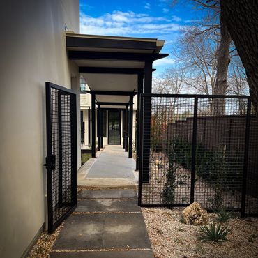 Horseshoe Bay Hill Country Texas House Remodel Builder Developer Calico Development Fence Landscape