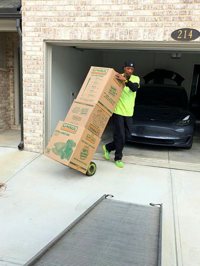 Mableton residential movers loading boxes for a local flat-rate home move in GA.