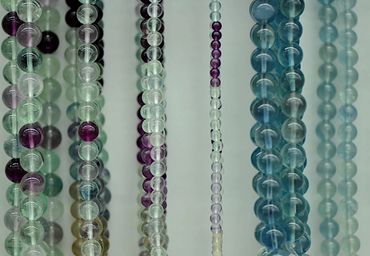Banded Fluorite and Light Blue Fluorite round beads.
