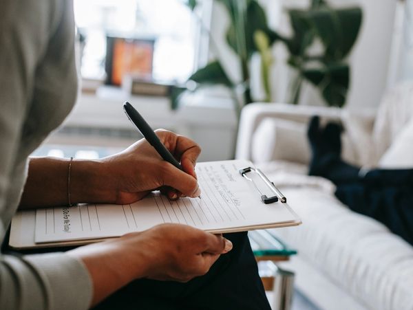 image of my hands taking notes while we talk