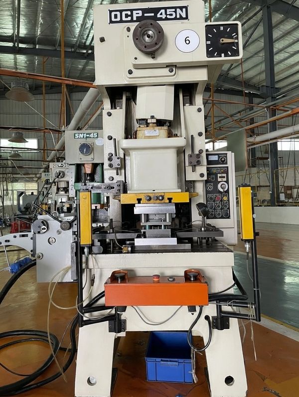 Industrial OCP-45N machine in factory setting.
