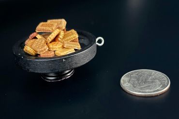 Hand-cast resin cookie stand; plastic dome