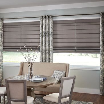Roman shades from ShadeZone blinds layered with custom drapery curtains for Vancouver and Langley