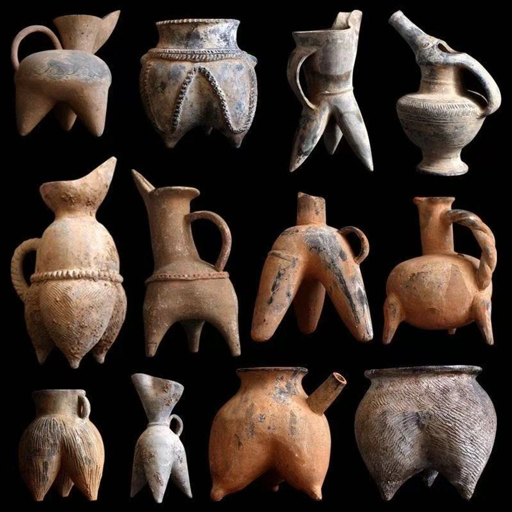 Ancient pottery vessels with unique tripod designs and handles.