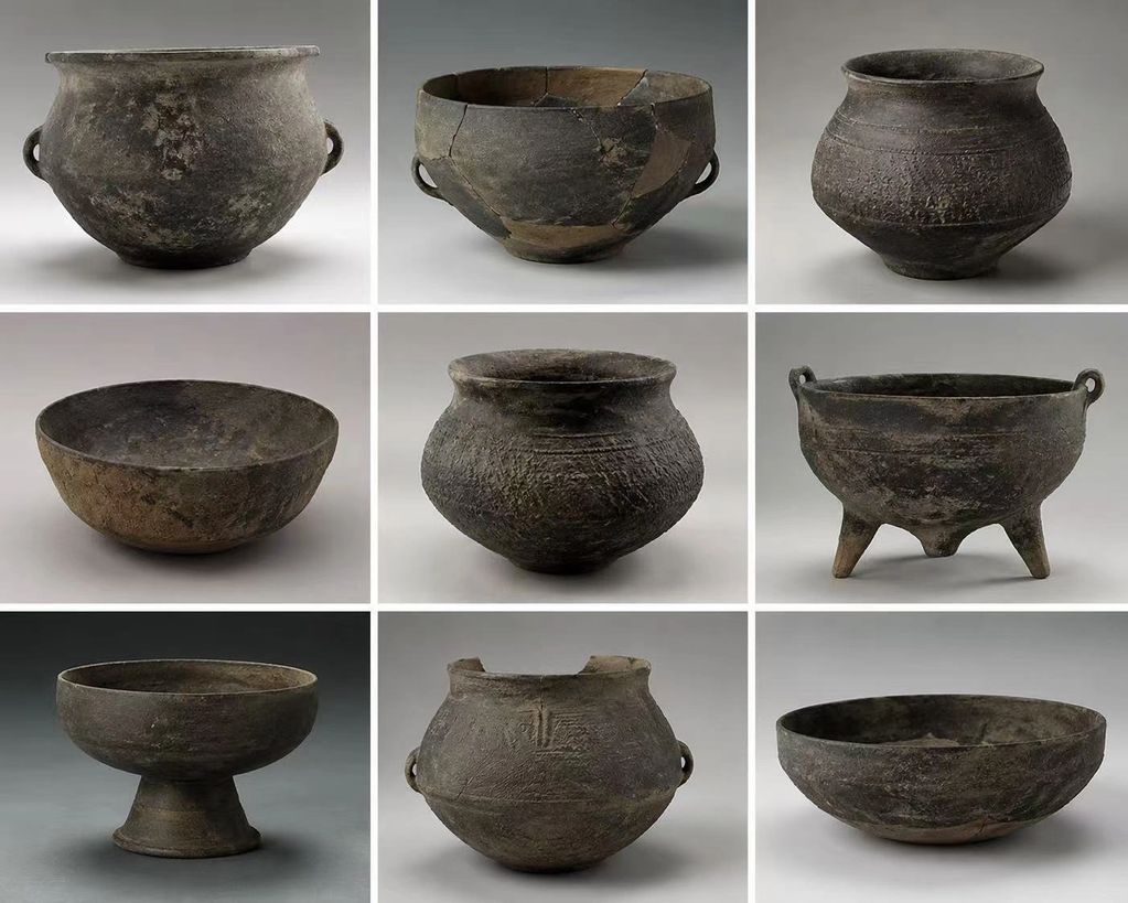 Collection of ancient pottery with varied shapes and textures.