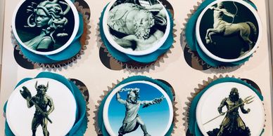 blue cupcakes with edible printed Greek Mythological images