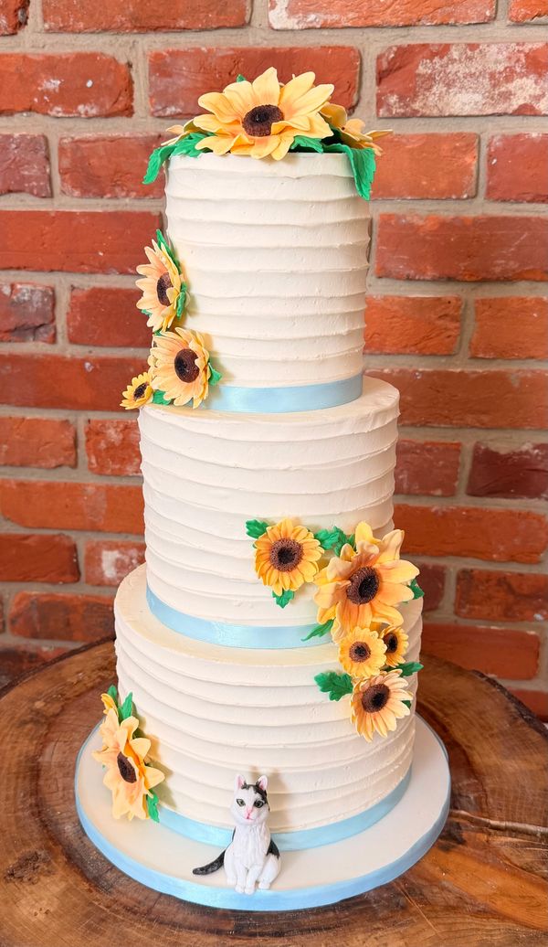 3 tier textured ivory buttercream wedding cake with sugar sunflowers