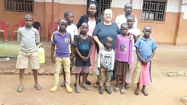 Children and missionaries posing together