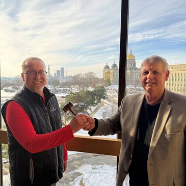 Passing the gavel. Outgoing President Gary Twedt passes the gavel to incoming President Jason Koest