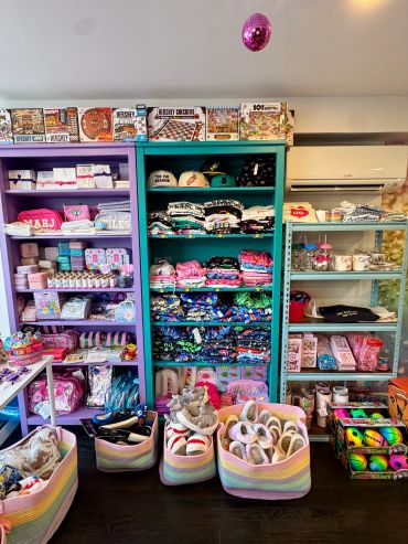 Gift and accessory area featuring boys clothing, jewelry, tote bags and all sorts of cute thing.