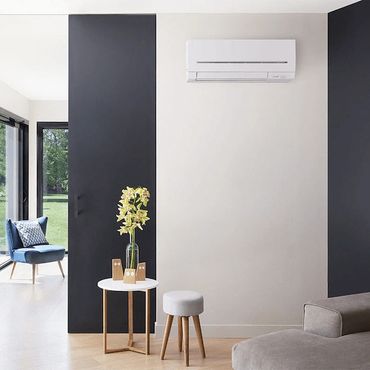 Modern living room with minimalist furniture and black accent walls.