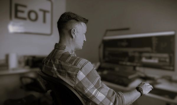 EoT co-owner Tony at a workstation developing IoT engineering solutions.
