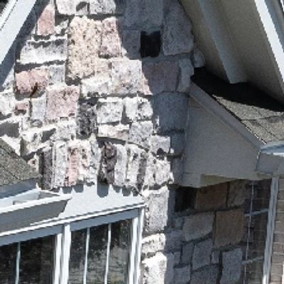 Modern home with Owens Corning roofing on a clear sunny day.